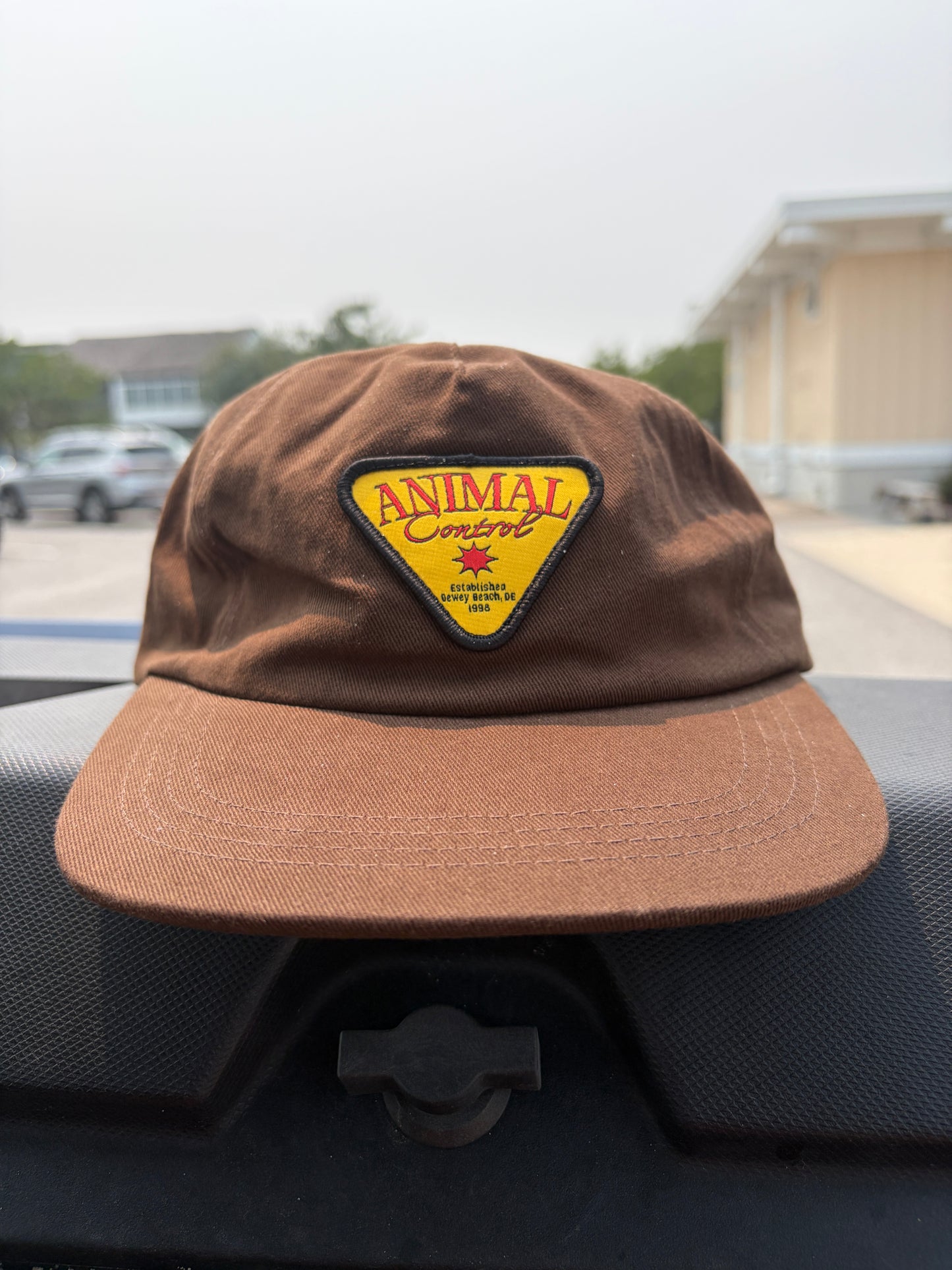 Brown and yellow hat